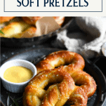 Round plate with two homemade soft pretzels and text title box at top