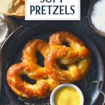 Overhead shot of two soft pretzels on a plate with text title overlay