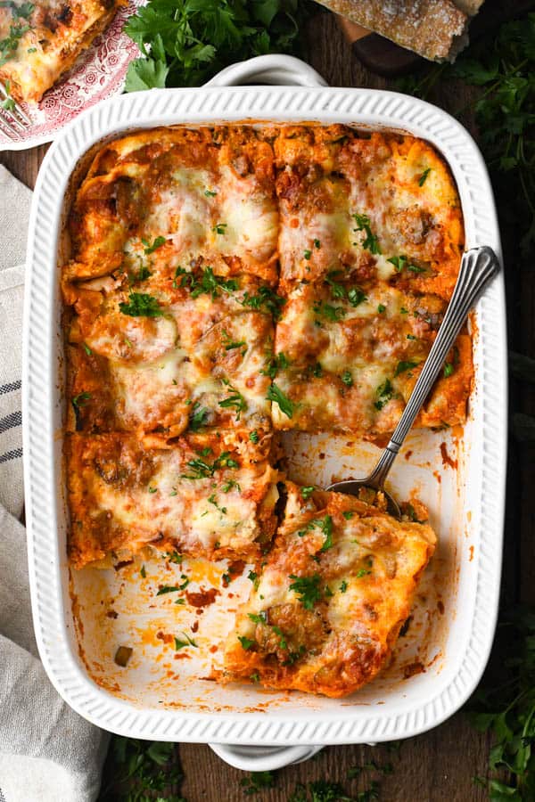 Overhead shot of vegetable lasagne in a white casserole dish