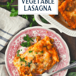 Overhead shot of a slice of vegetable lasagna on a plate with text title overlay
