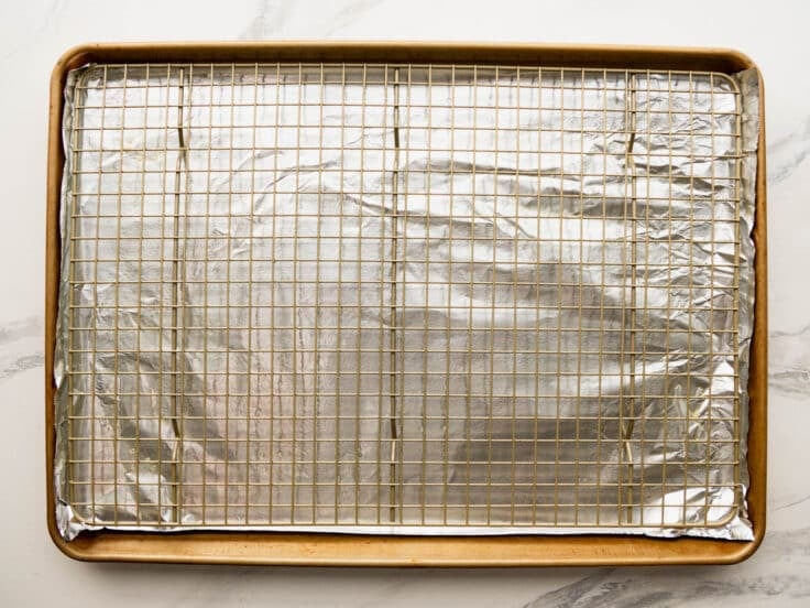 Wire rack on a rimmed baking sheet.