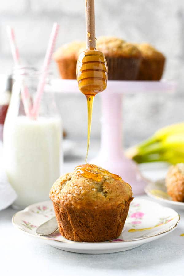 Drizzling honey on the best banana muffins