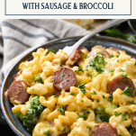 Side shot of a bowl of cheesy smoked sausage pasta with text title box at top