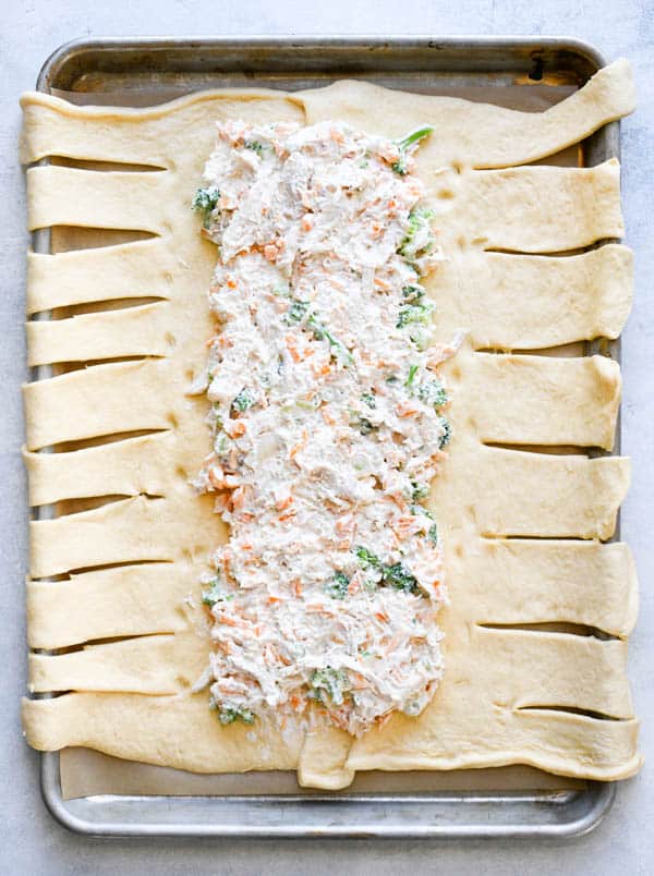 Process shot showing how to make chicken and broccoli crescent braid