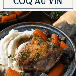 Front shot of a bowl of coq au vin with text title box at top