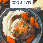 Overhead shot of coq au vin in a bowl with text title overlay