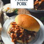 Dr pepper pulled pork sandwiches on a plate with text title overlay