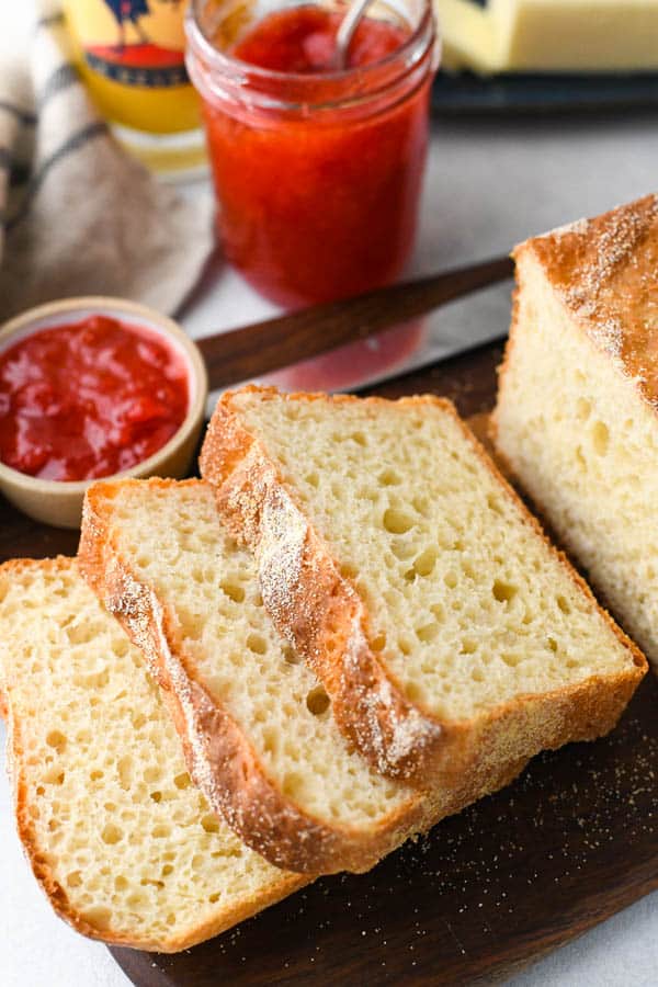 No Knead English Muffin Bread sliced on a cutting board