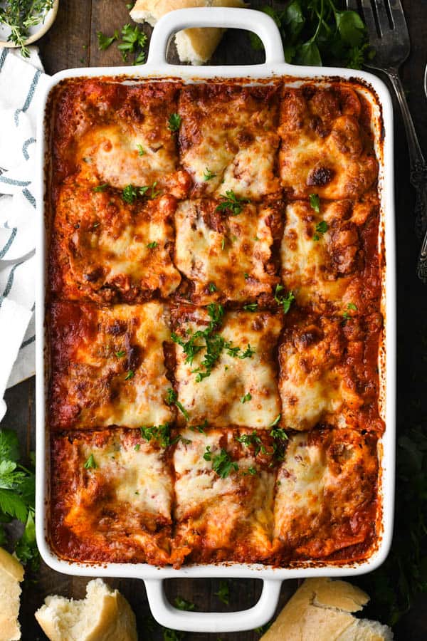 A traditional lasagna recipe in a white baking dish