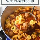 Ladle in a pot of meatball soup with cheese tortellini and text title box at top