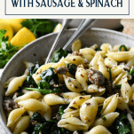 Close up shot of pasta with sausage and spinach with text title box at top