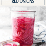 Front shot of a jar of quick pickle red onions with text title box at top