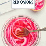 Overhead image of simple pickled red onions in a glass jar with text title overlay