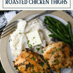 Overhead image of a plate of crispy roasted chicken thighs with text title box at top