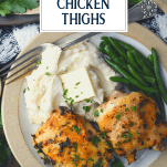 Overhead shot of a plate of crispy baked chicken thighs and text overlay