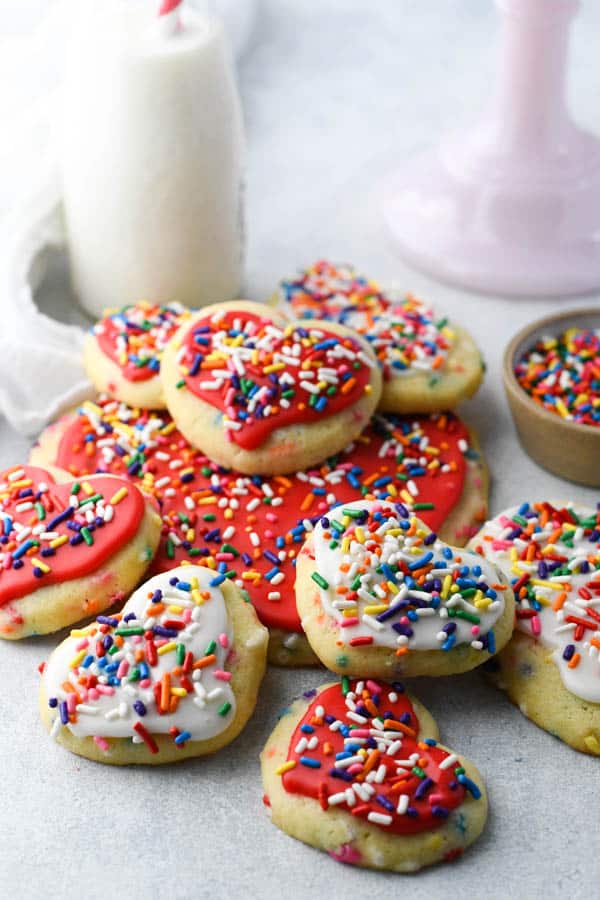 Front shot of frosted cut out sugar cookies with sprinkles