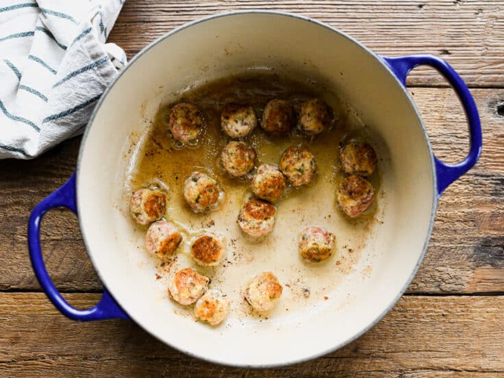 Browning homemade meatballs for slow cooker Italian wedding soup.