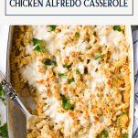 Chicken alfredo recipe in a white baking dish with text title on top