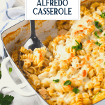 Chicken alfredo bake in a white dish with text title overlay