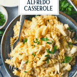 Bowl of chicken alfredo casserole with text title overlay