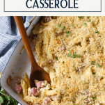 Overhead shot of a tray of chicken cordon bleu casserole with text title box at top