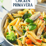Front shot of a bowl of chicken primavera with text title overlay