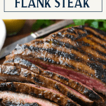 Close up front shot of a sliced flank steak with seared grill marks and a text title box at top