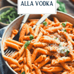 Bowl of penne alla vodka with text title overlay