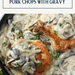 Smothered pork chops in a skillet with text title box at top