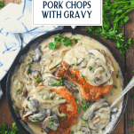 Mushroom smothered pork chops in a cast iron skillet with text title overlay