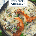 Overhead shot of a skillet full of classic pork chops with gravy and text title overlay