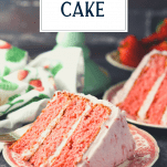 Slice of the best strawberry cake recipe on a red and white plate with text title overlay