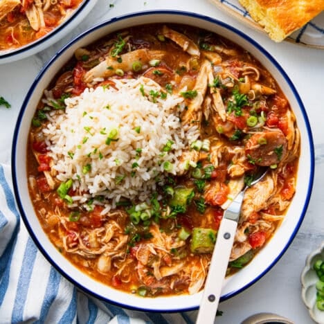 Square overhead shot of a bowl of chicken and sausage gumbo.