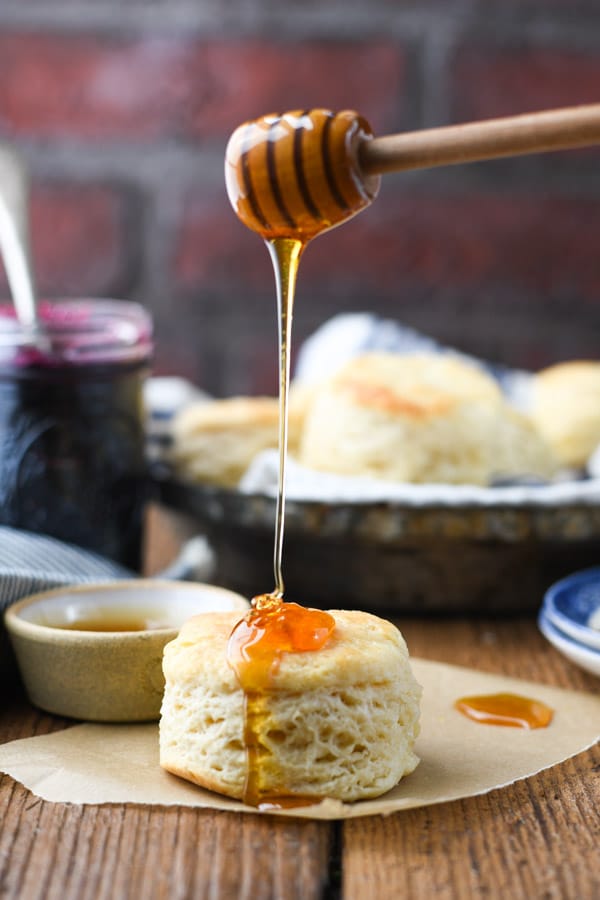 Drizzling honey on a 3 ingredient biscuit recipe