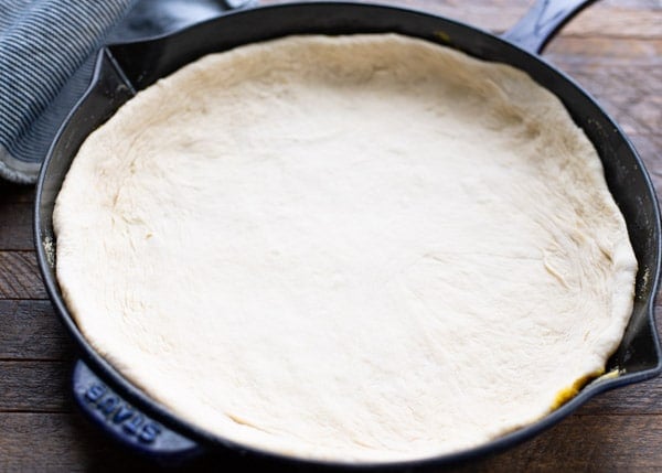 Cast iron skillet pizza dough in a pan