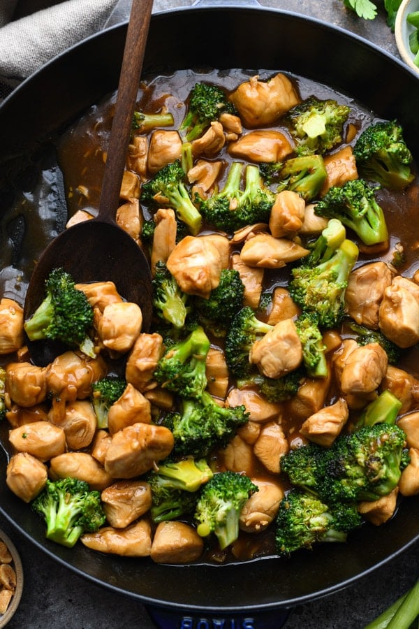 Close overhead image of chinese chicken broccoli stir fry in a pan