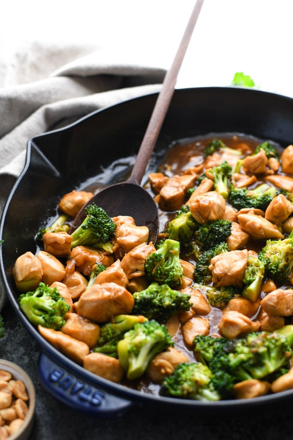Spoon in a skillet of easy chicken and broccoli stir fry