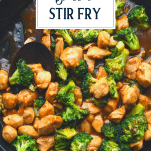 Close overhead shot of chicken and broccoli stir fry with text title overlay