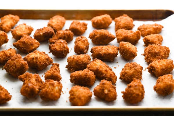 Process shot showing how to make homemade chicken nuggets