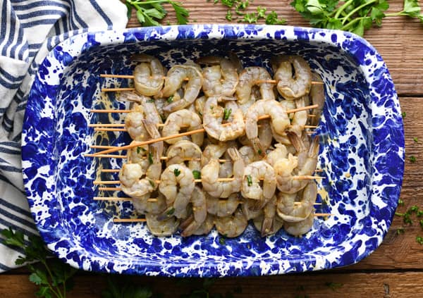 Process shot showing how to make grilled shrimp