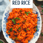 Overhead shot of Savannah red rice recipe in a bowl with text title overlay
