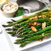 Square side shot of a platter of sauteed asparagus