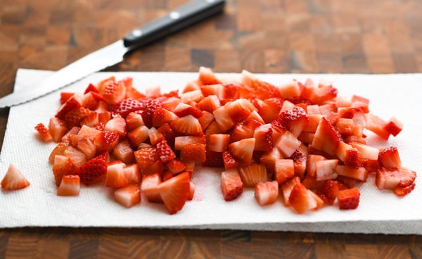 Diced strawberries on a paper towel