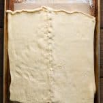 Crescent dough sheets on a baking sheet.
