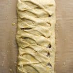 Process shot showing how to make a homemade Stromboli crescent braid