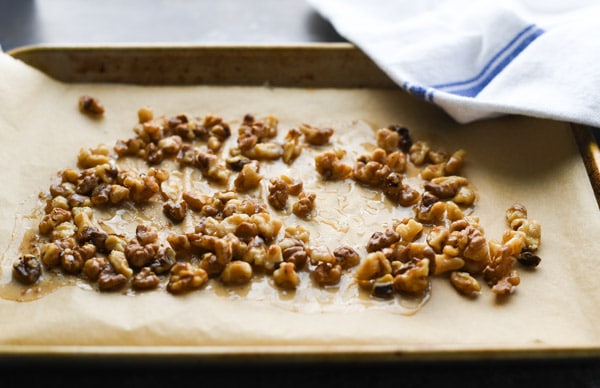Candied walnuts on a baking sheet