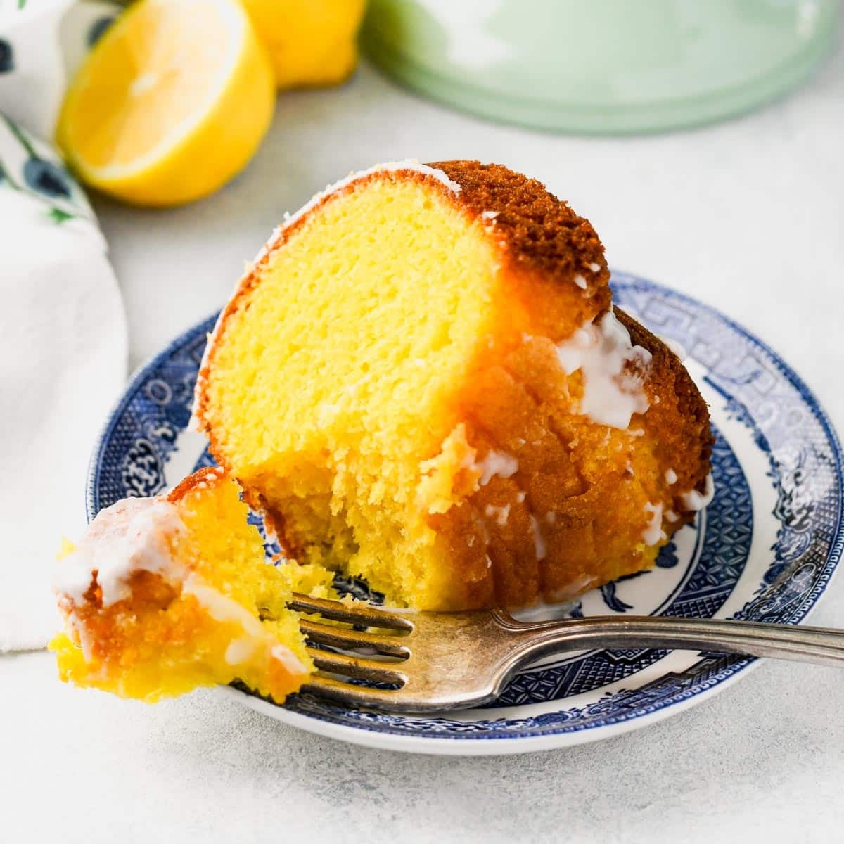 Bite of lemon cake on a fork.
