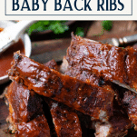 Side shot of dry rub baby back ribs in the oven with text title box at top