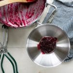 Process shot of canning blackberry jam