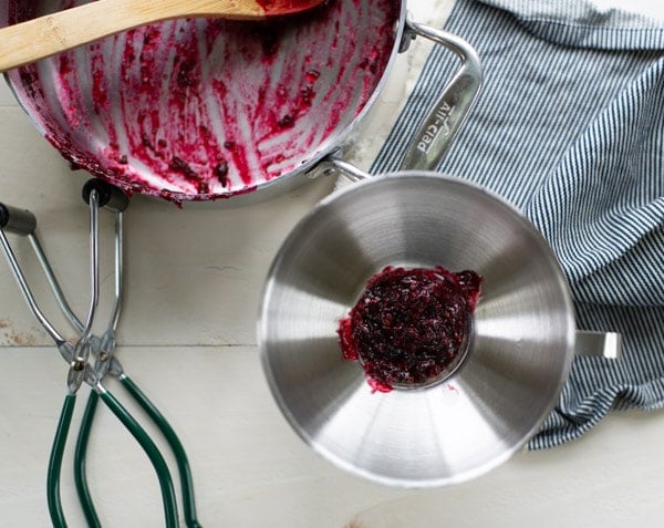Process shot of canning blackberry jam